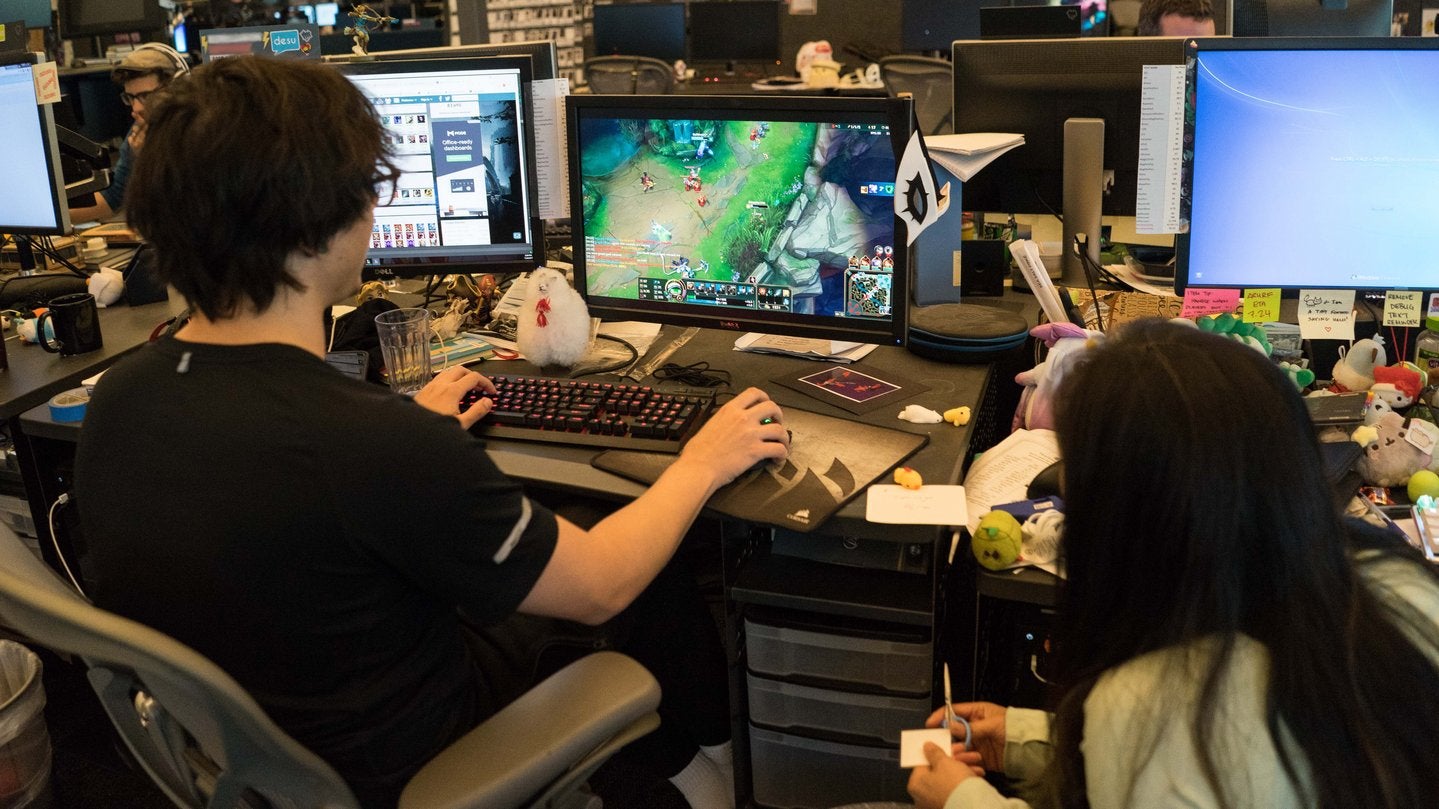 Two employees working at Riot Games