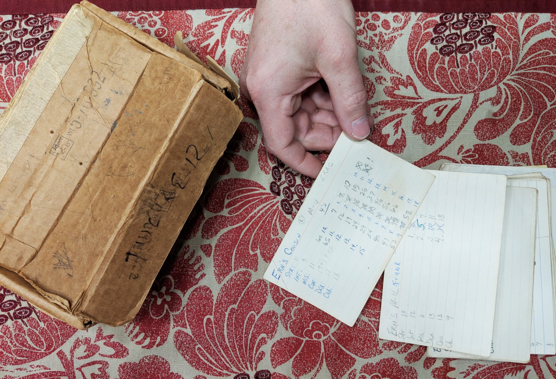 Paul Stormberg displaying original “character sheets” from the Dungeons & Dragons prototype.