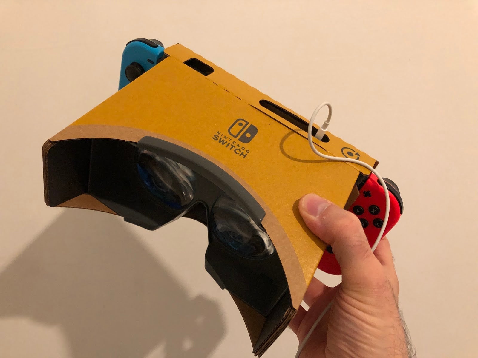 Nintendo Switch VR requires the Nintendo Labo VR goggles. While the goggles are mostly cardboard and therefore very light, the set-up necessitates that a user holds the system to their face. There is no headstrap, and the act of manipulating game controls inches from your face can be awkward. It is awkward for the Mario and Zelda VR modes.