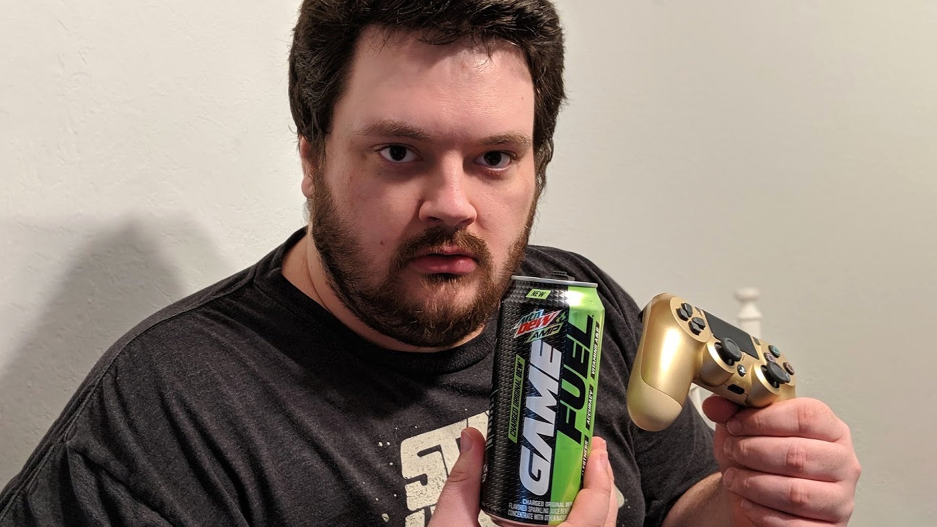 The face of a man who is ill, but who also loves video games and drank too much MTN DEW Amp Game Fuel.