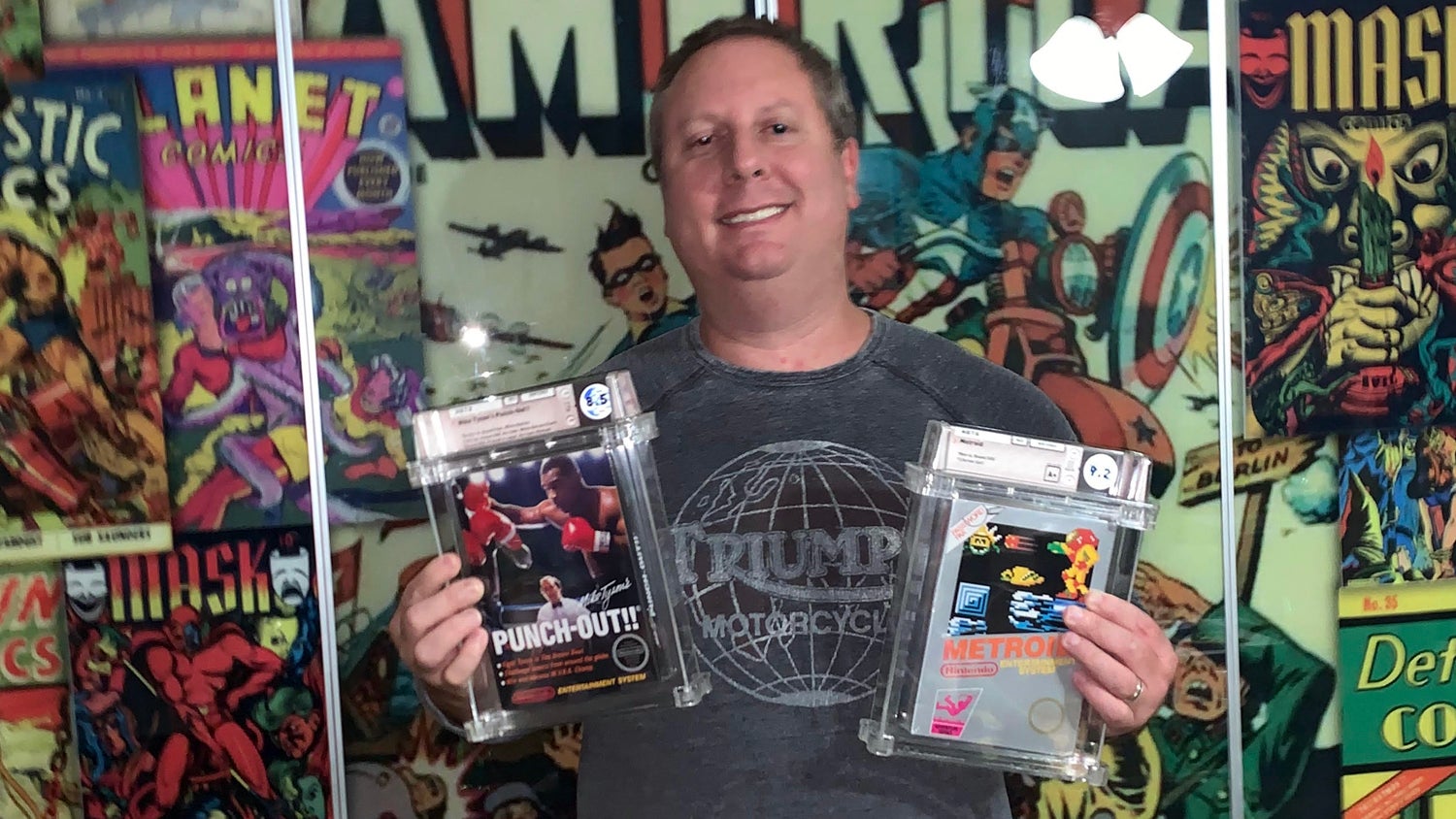 Joshua Entin holds high-grade copies of the NES games Mike Tyson’s Punch-Out and Metroid