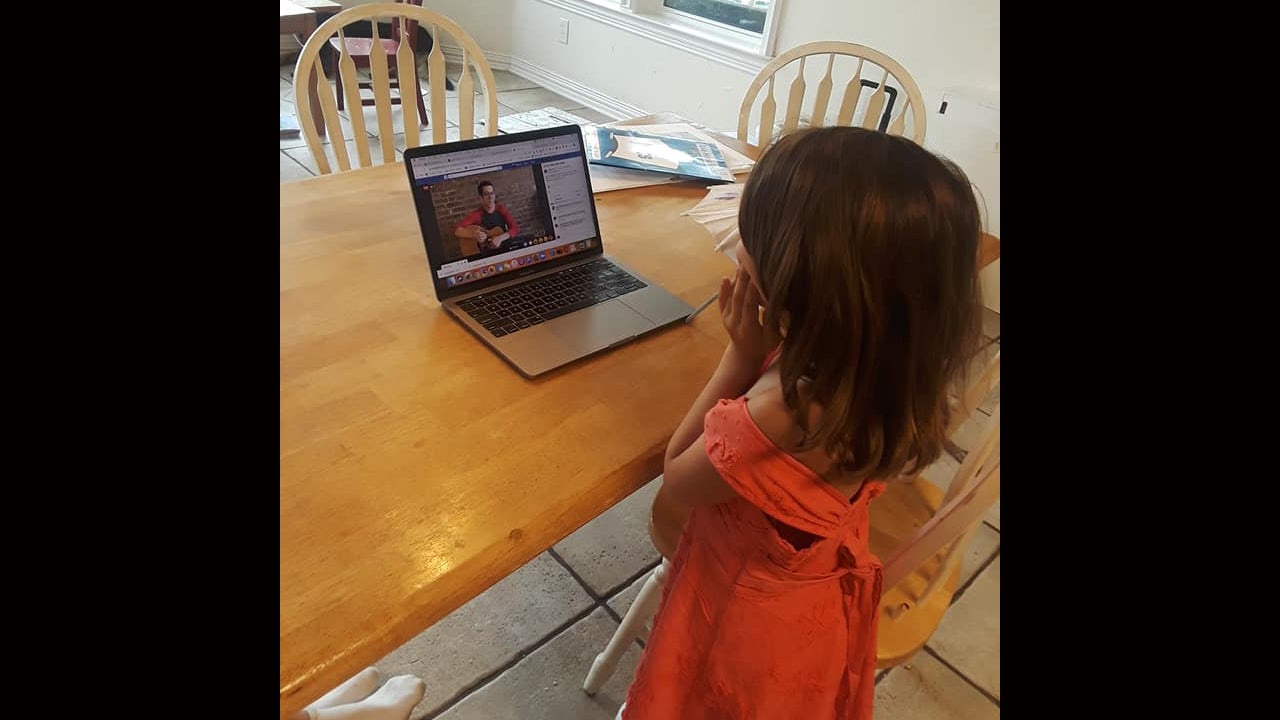 My niece watches a livestream of Lifechurch’s youth music offering, “Mr. Music,” in her “fancy dress.” (Image used with parental permission.) 