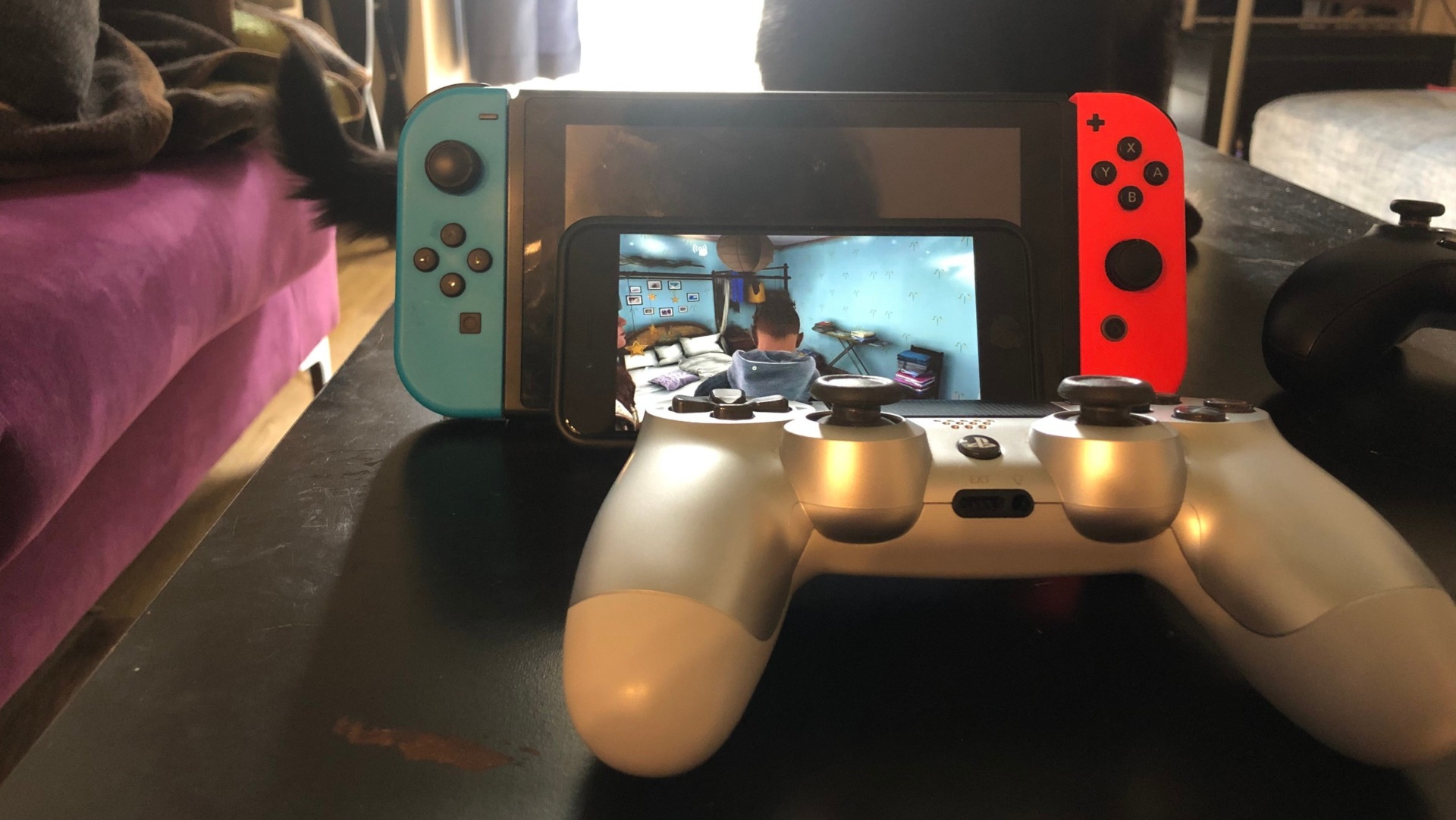 Yes, that’s me using a PS4 controller to play Xbox games on an Apple phone leaning up against a Nintendo console. How’s that for Corporate Synergy®?