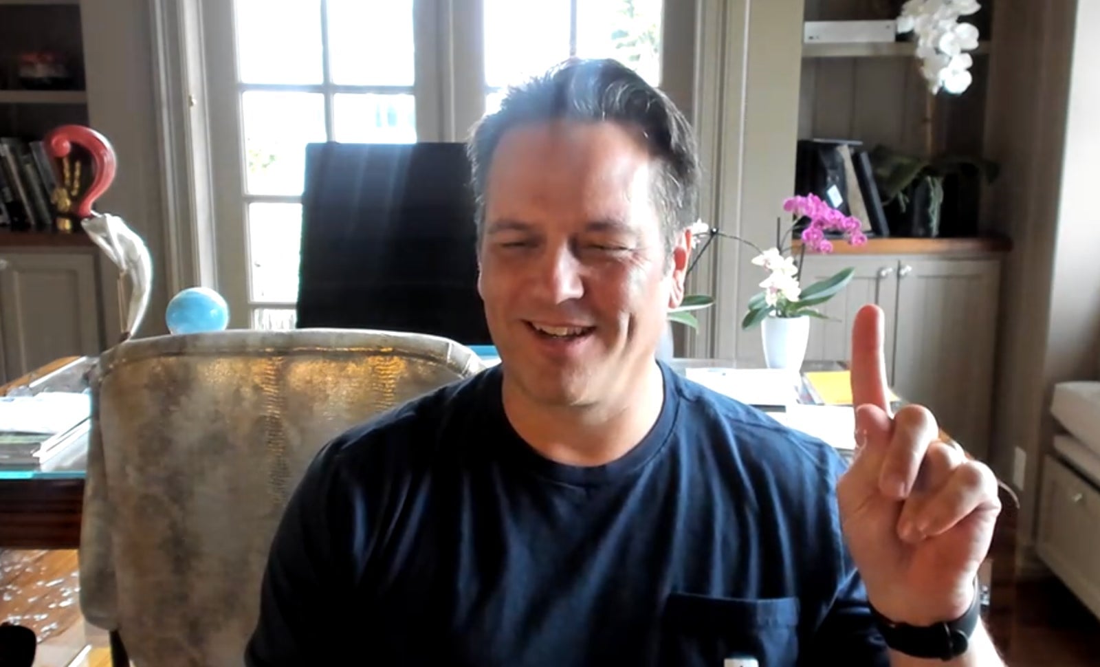 Spencer at home during his interview for this story. The plant now has white flowers.