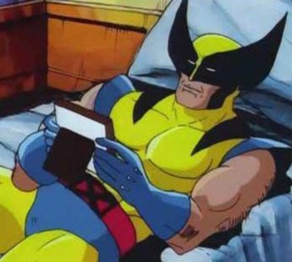 Wolverine sits in bed.
