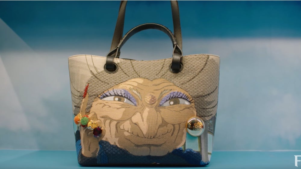 This isn’t subtle at all—which is why it’s so fun. Note the rings and the earring. 