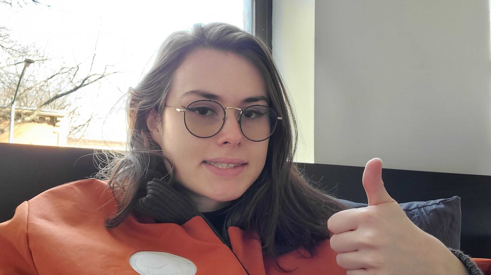 An awkward smile, like an earnest version of The Expression. It is one of deep discomfort.