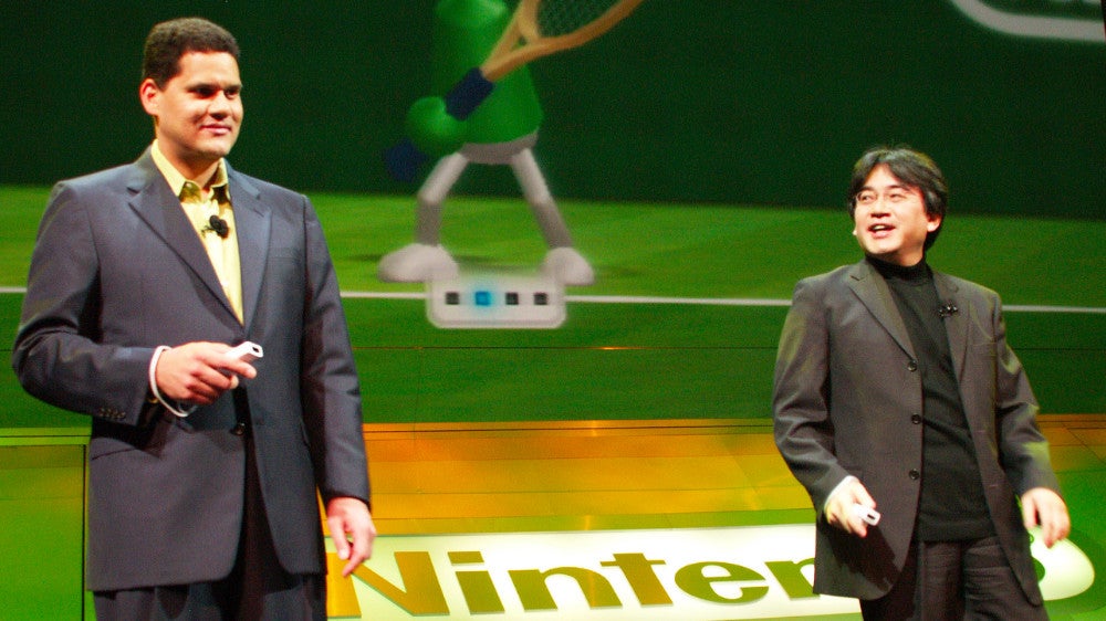 Reggie and Iwata on stage at Nintendo’s 2006 E3 press conference. 