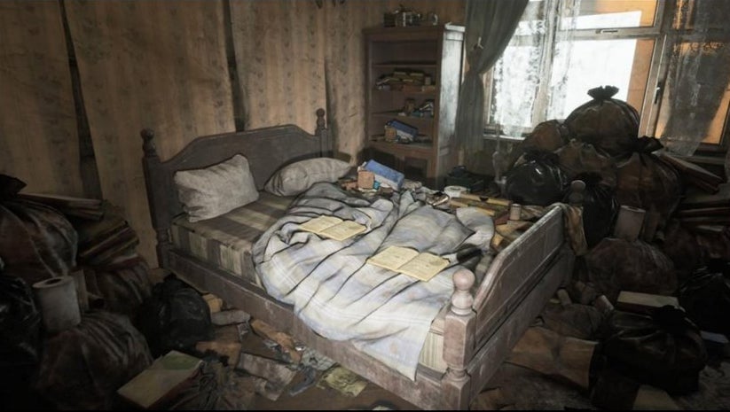 A leaked Silent Hill image from sleuther Dusk Golem showing an unkempt bedroom covered in boxes and books and garbage, again possibly indicating that this spot belongs to some sorta hoarder in the game.