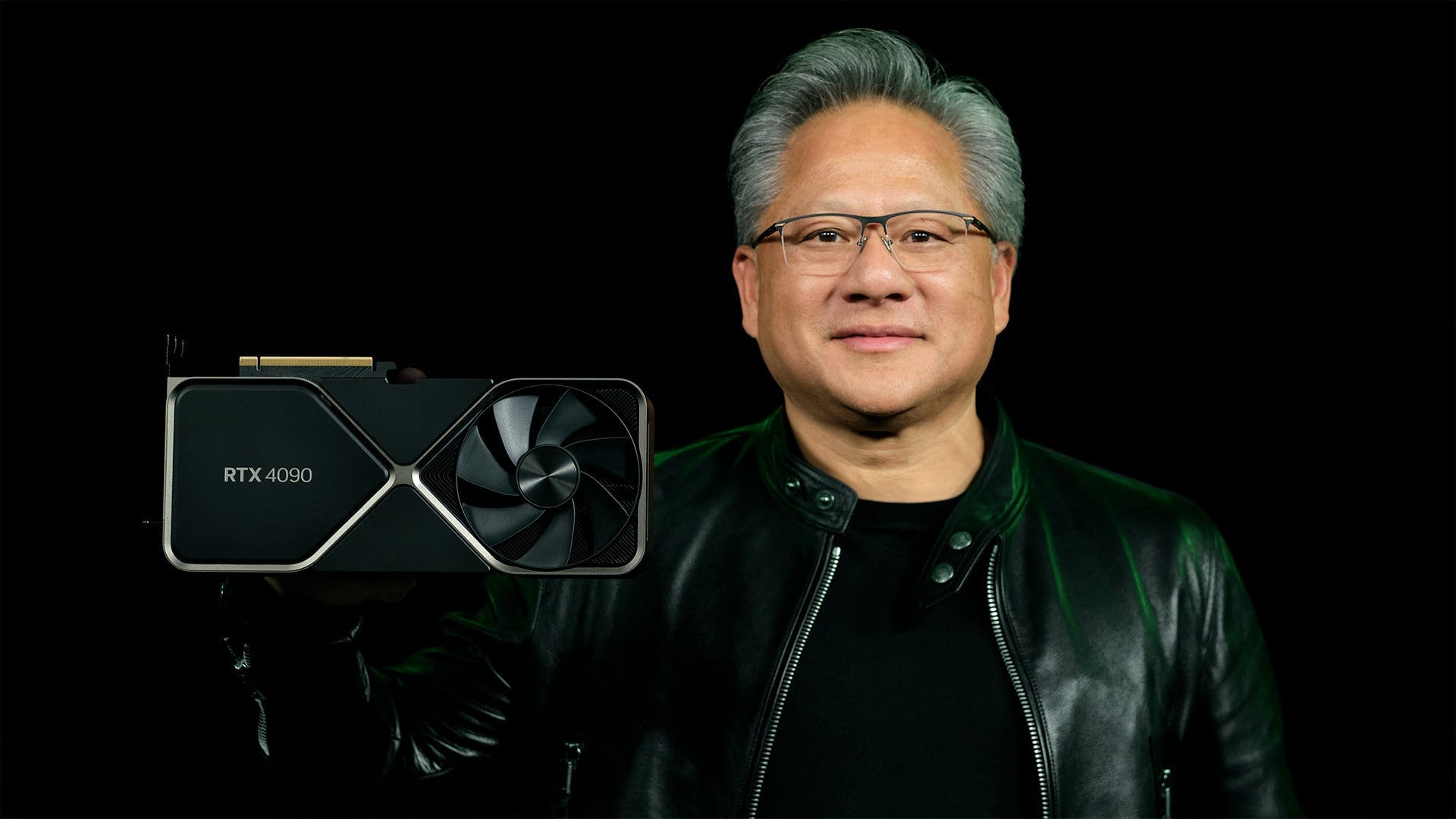Jensen Huang holds up a GPU.