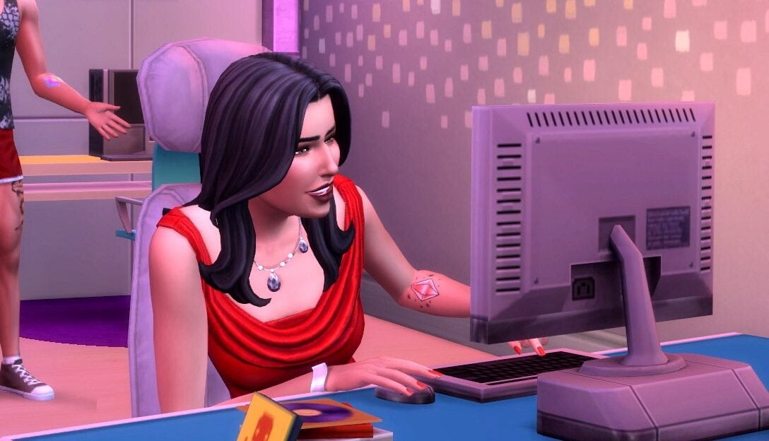 A Sim looks at her computer with a confused face.