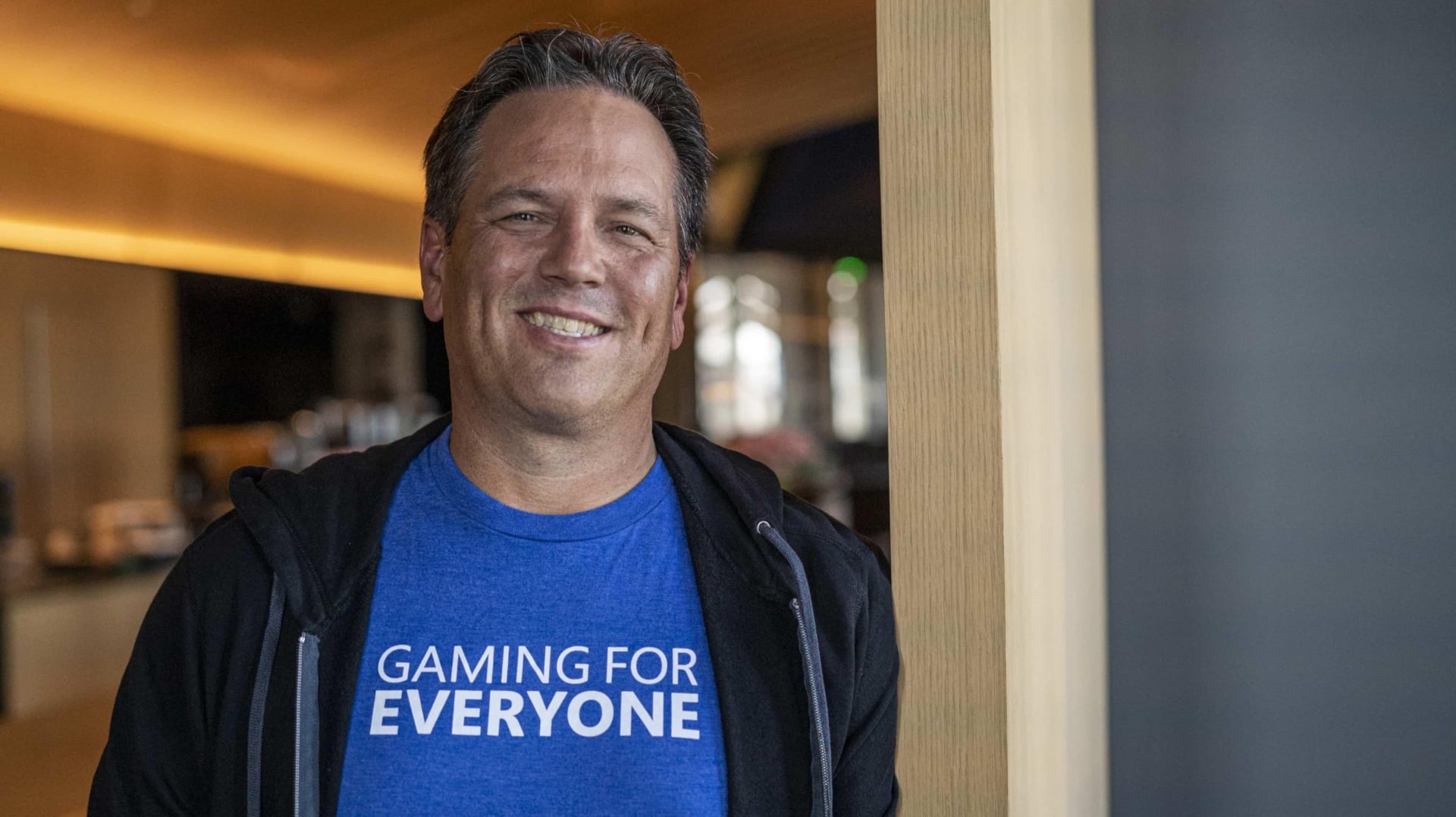 Phil Spencer wears a blue shirt.