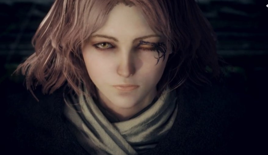 Melina looks at something off-screen