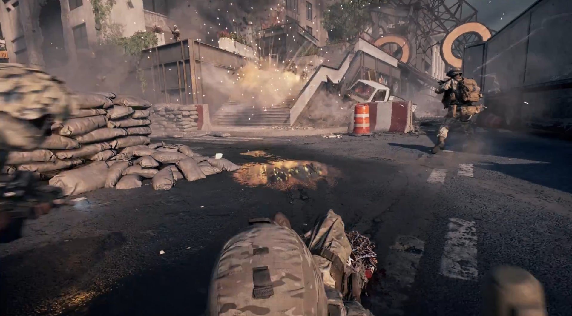 A player drags a downed squadmate to safety in footage released by EA.