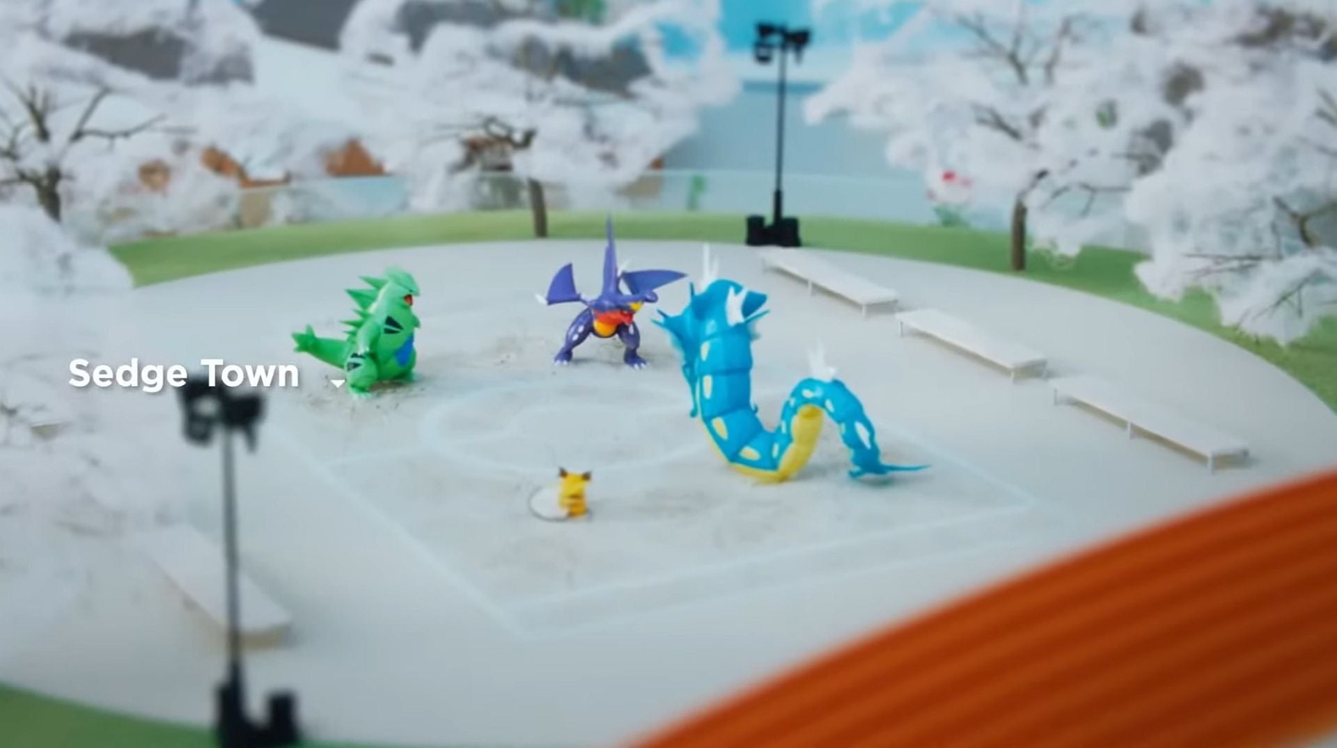 Plastic Pokemon figures on a table.
