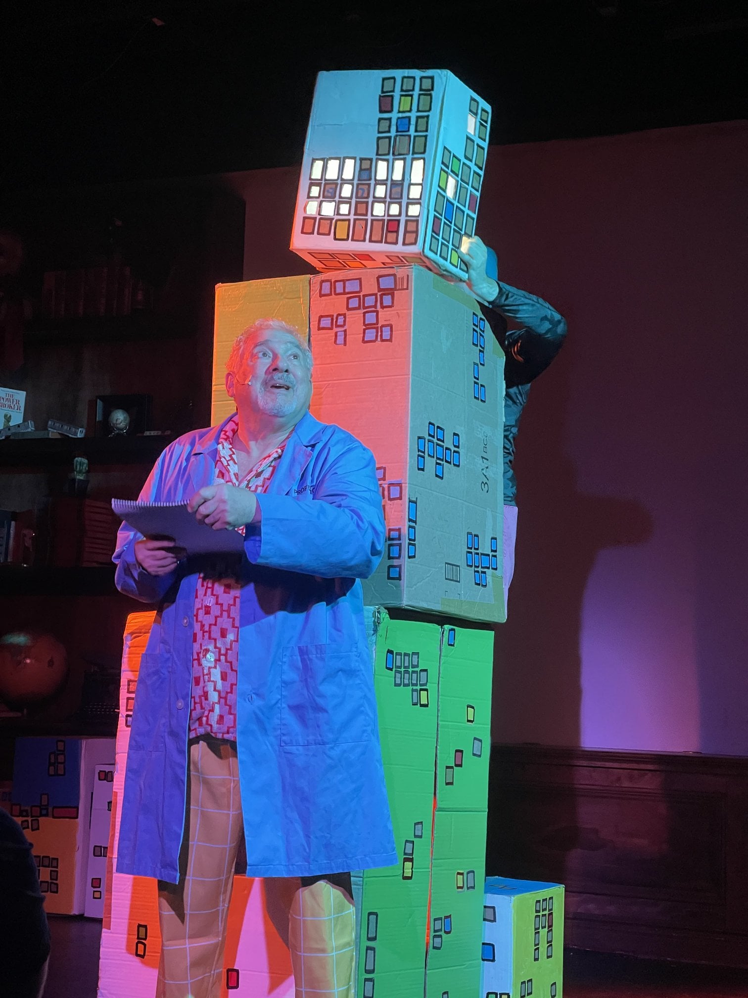 The Professor looks at something off-screen.