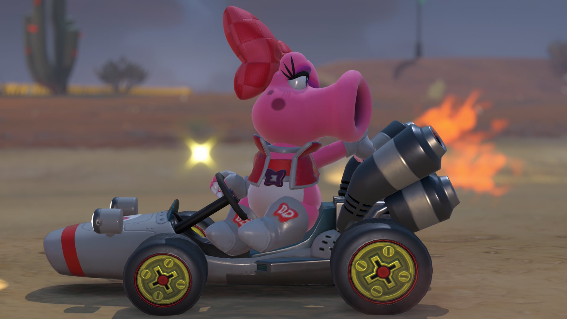 Birdo looks behind her while racing forward.