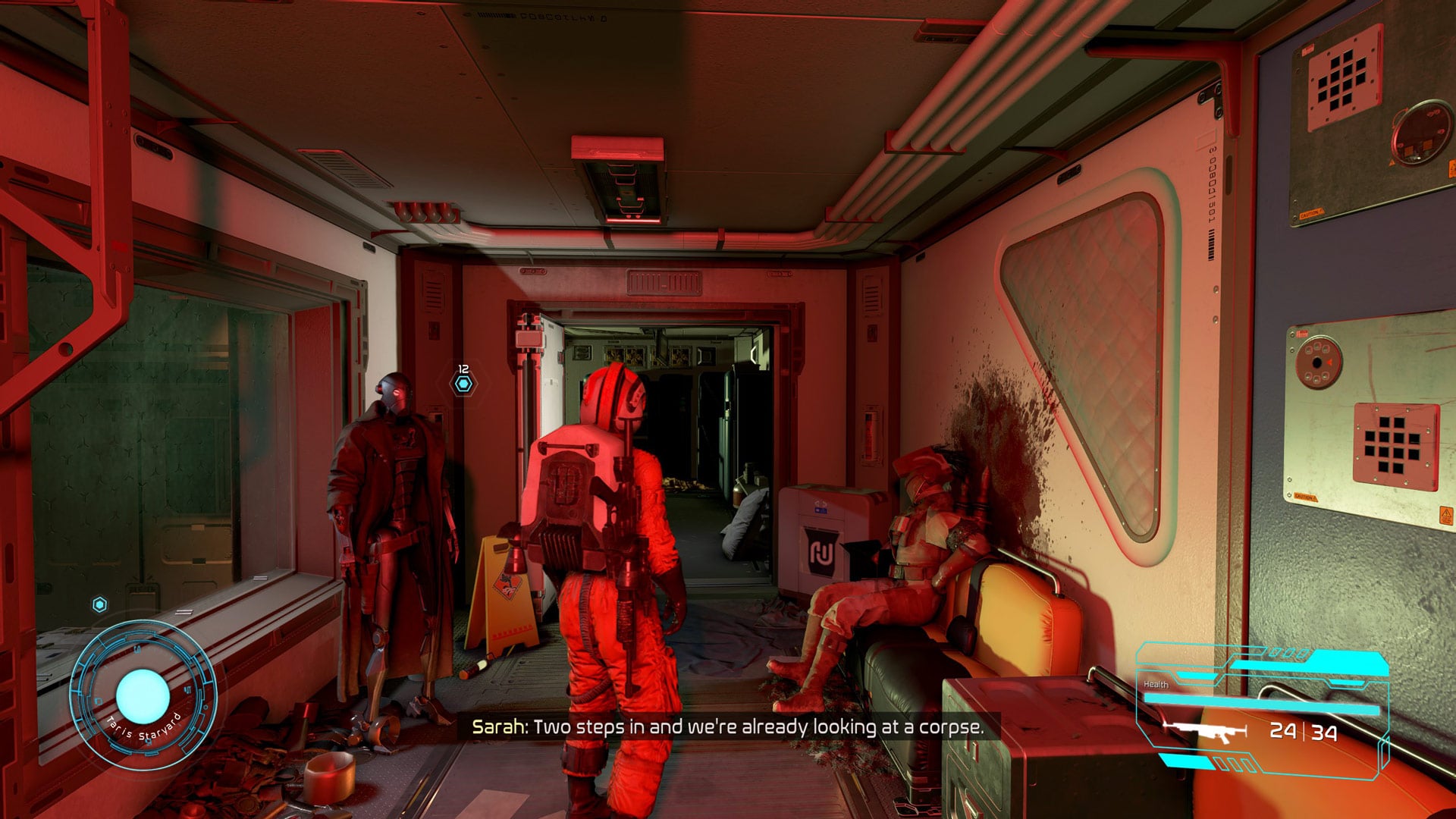 A Rebel pilot stands in a corridor next to a droid and a dead body.