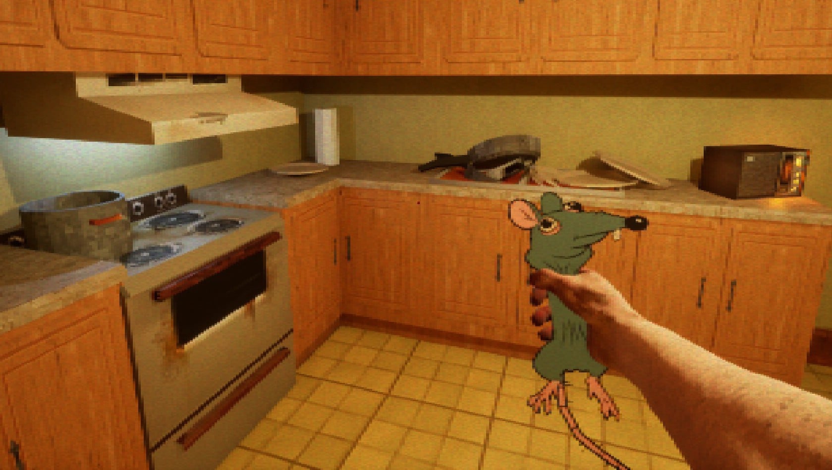 A man holds a rat in a kitchen.