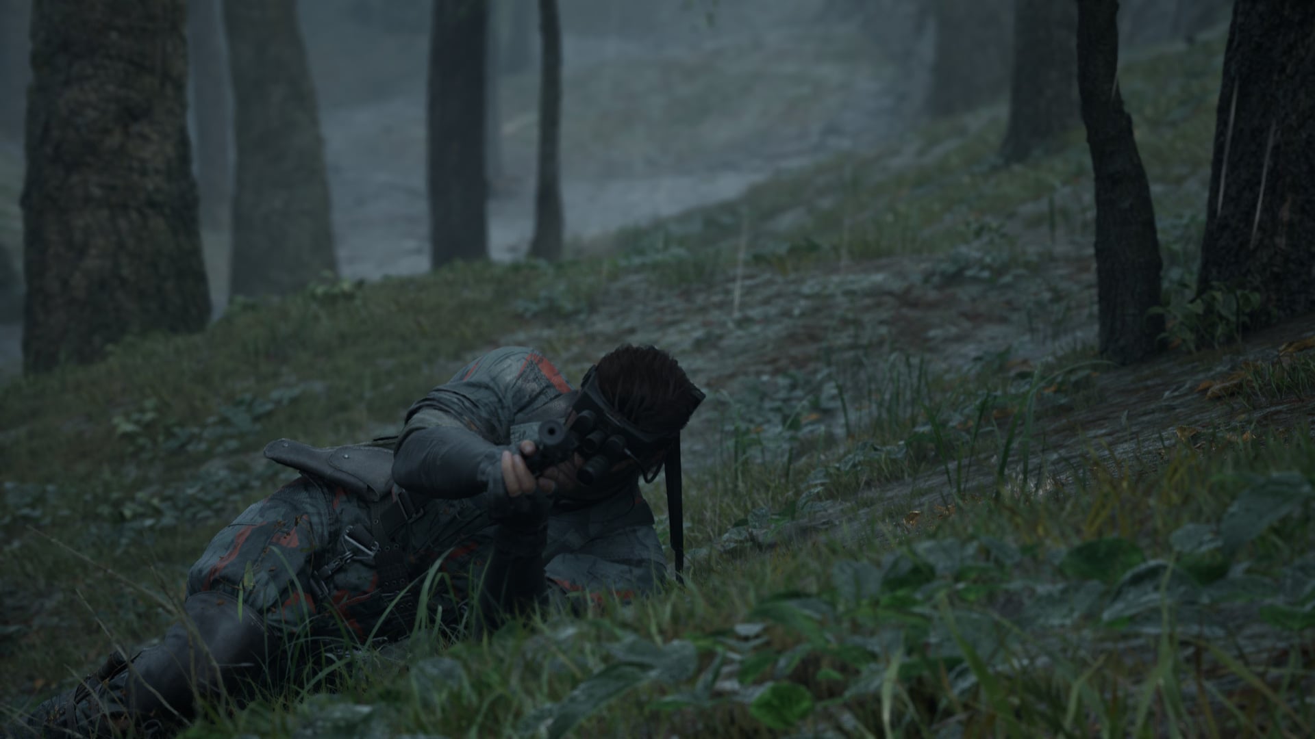 Snake lays in the grass while lining up a shot.