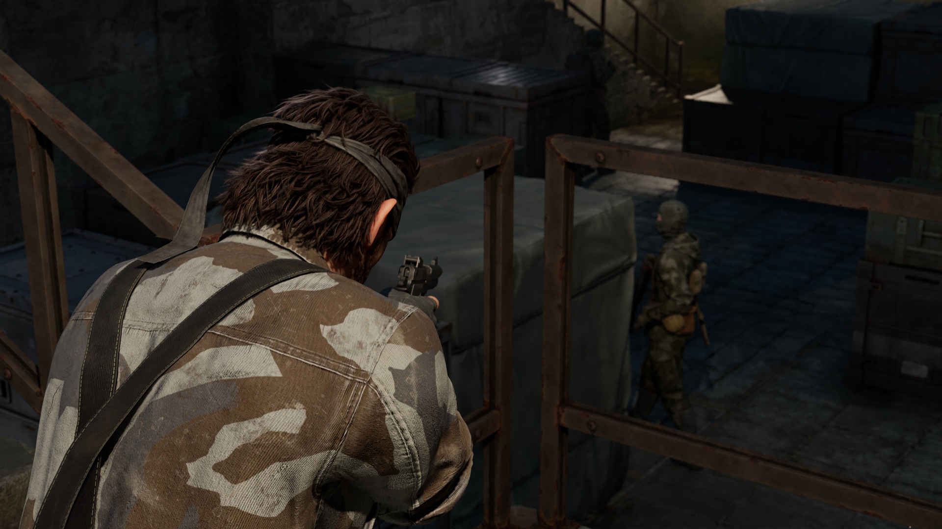 Snake aims a gun at an enemy.