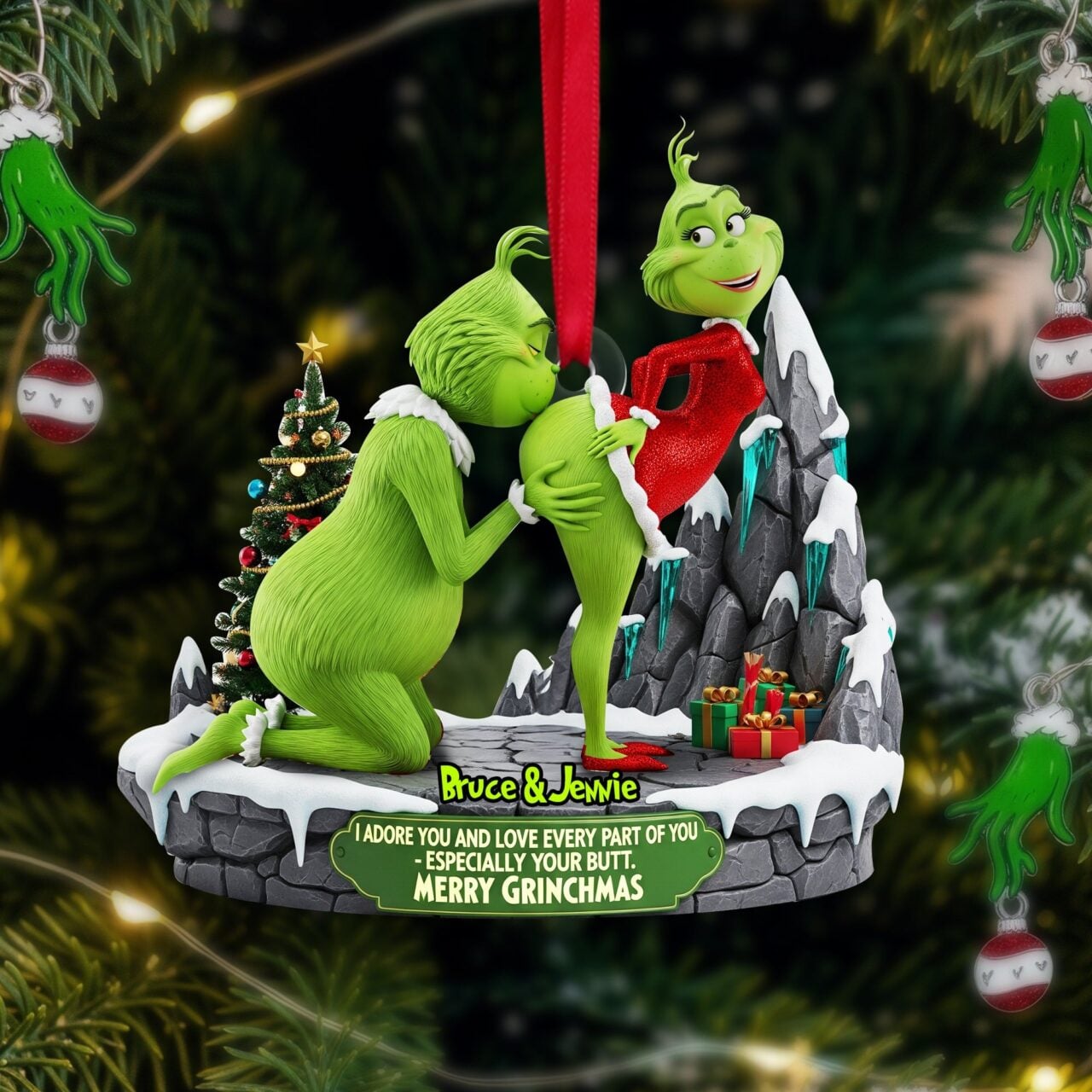 An ornament of the Grinch and a lady Grinch doing stuff doing something Jesus probably didn't expect when he died on the cross.
