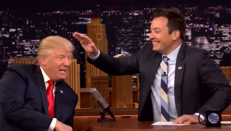 Jimmy Fallon rubs Trump's head on the Tonight Show.