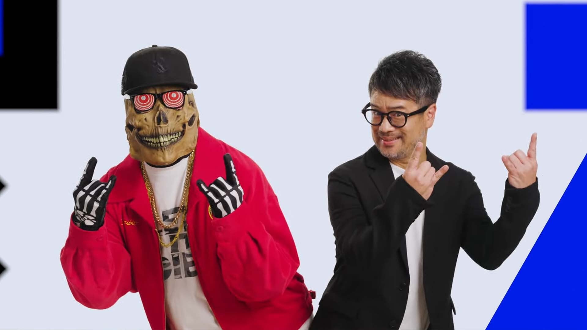 Two guys doing devil horns.