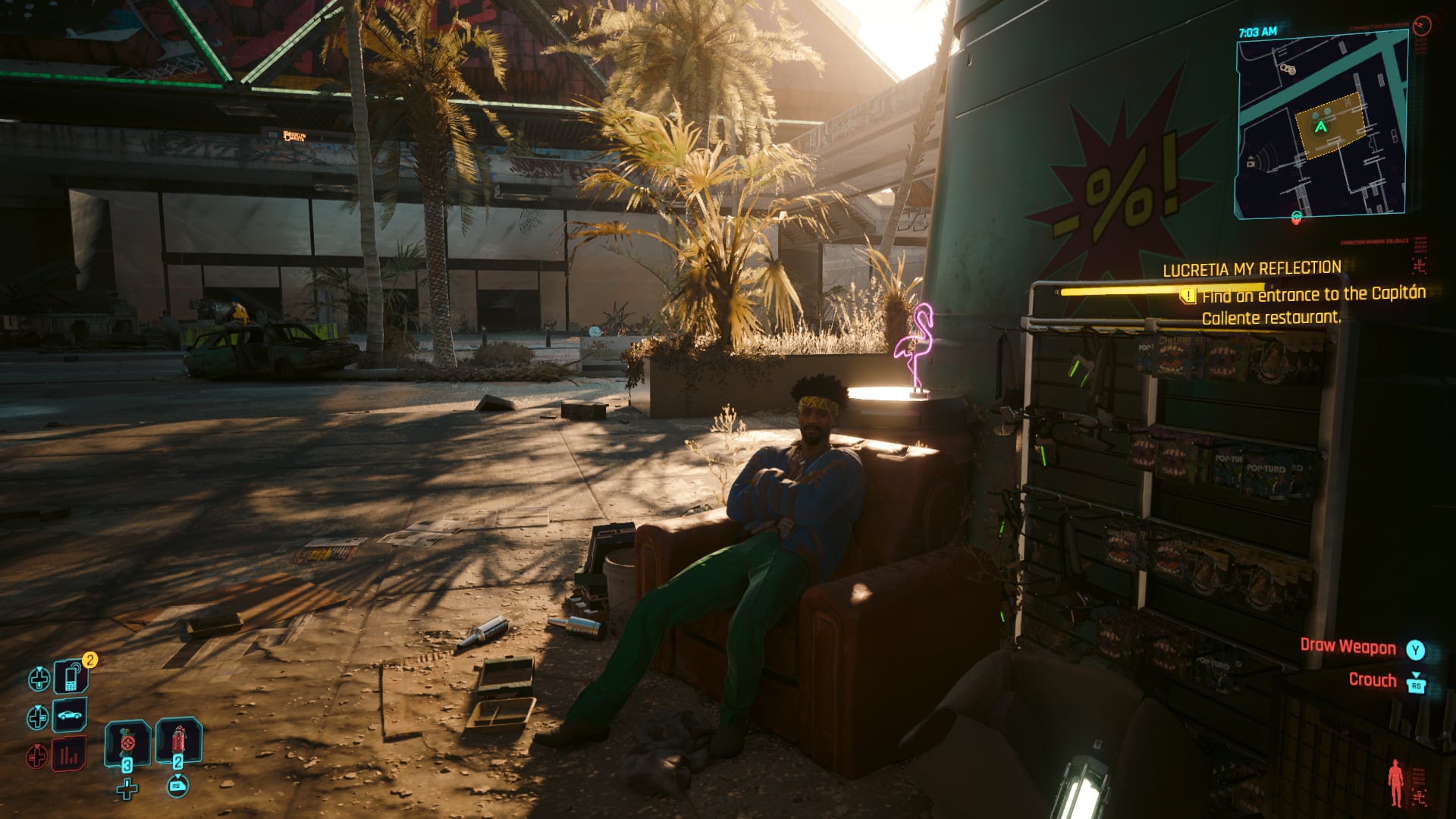 A guy sits in a chair outside. 