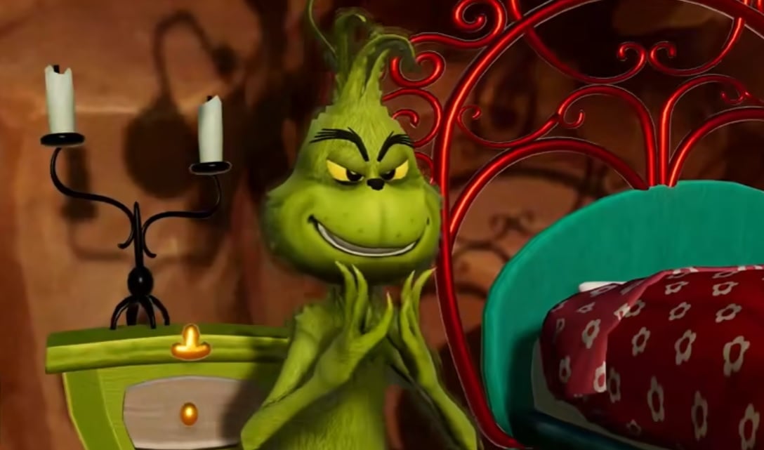 The Grinch twiddles his fingers.