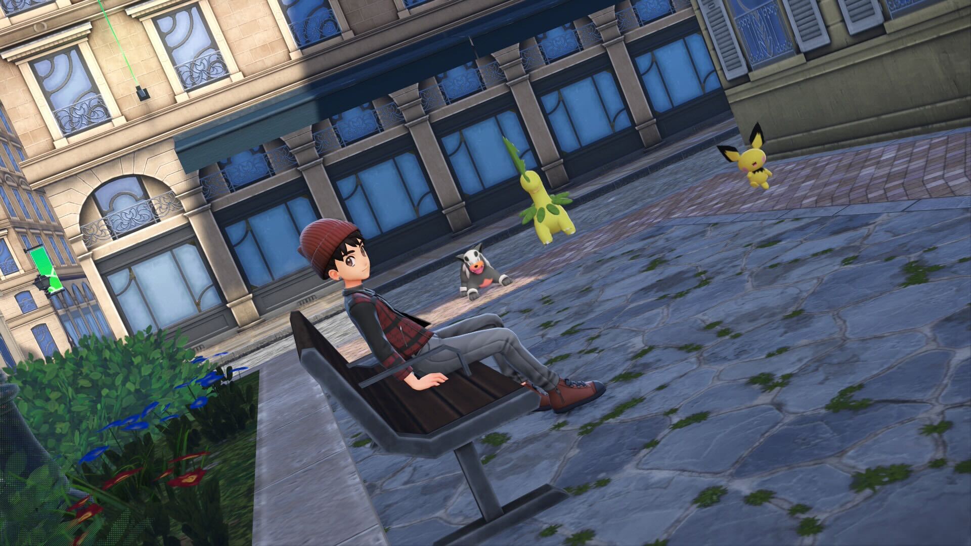 Shep sits on a bench as Houndour, Bayleef, and Pichu watch from the side.