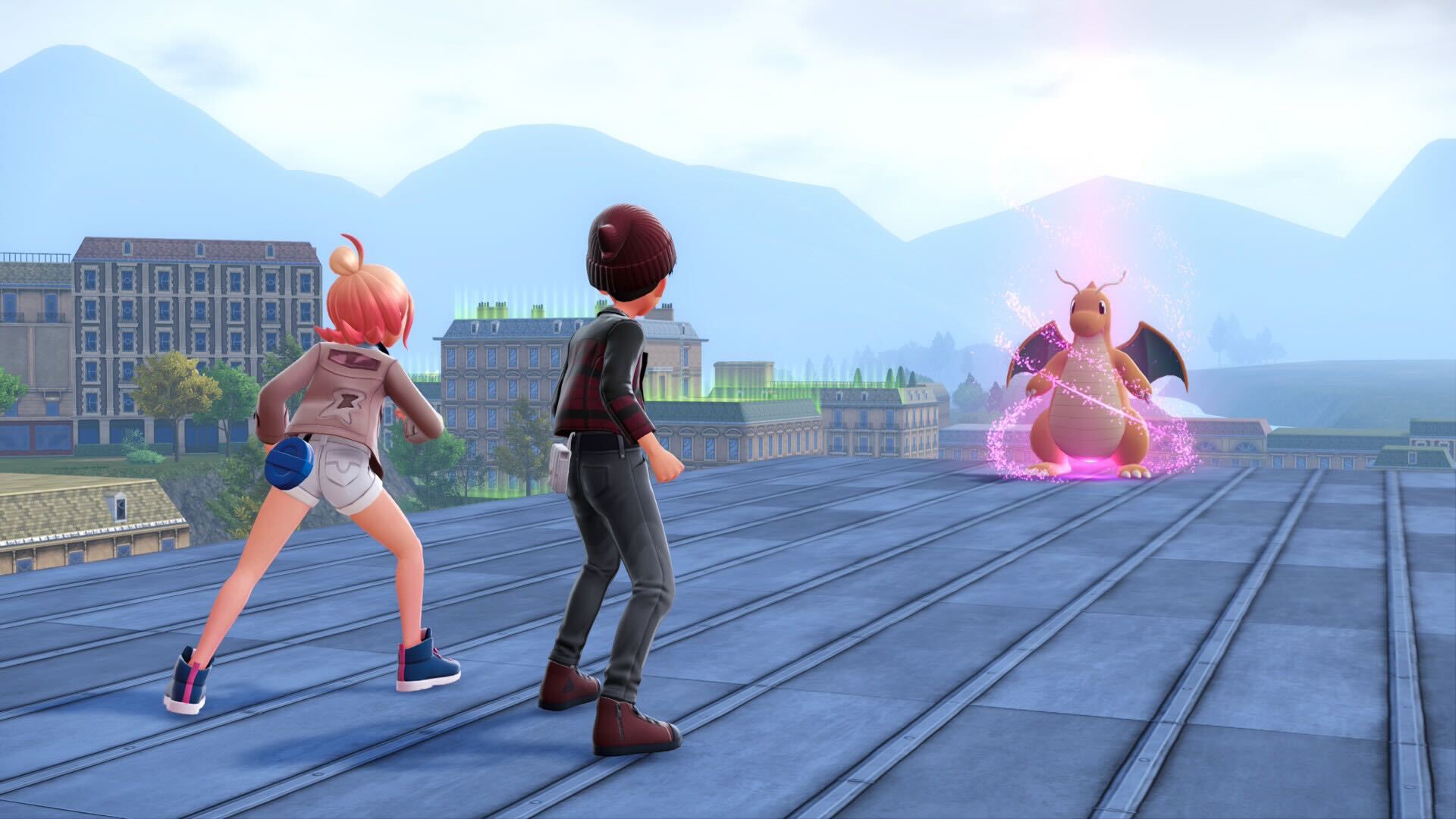 Shep and Taunie approach a glowing Dragonite