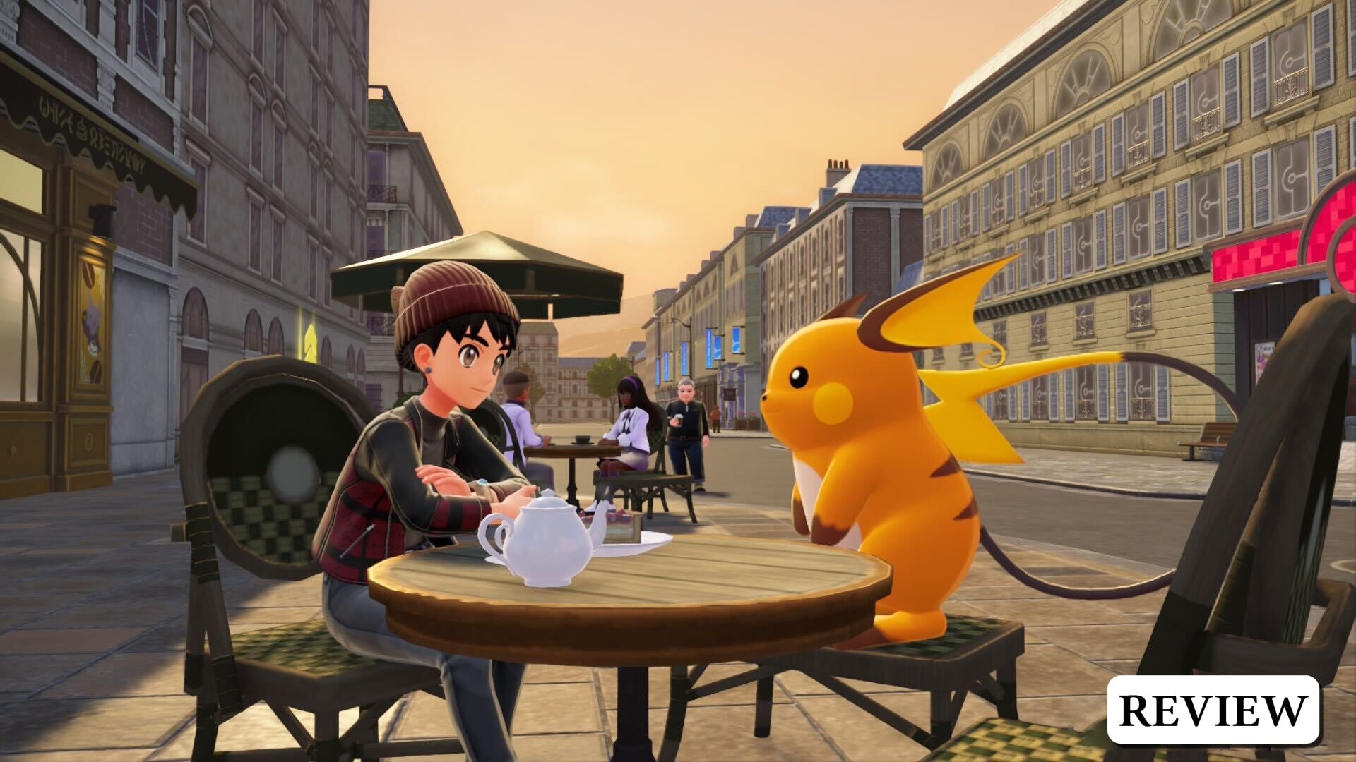 Shep and Raichu sitting at a cafe table