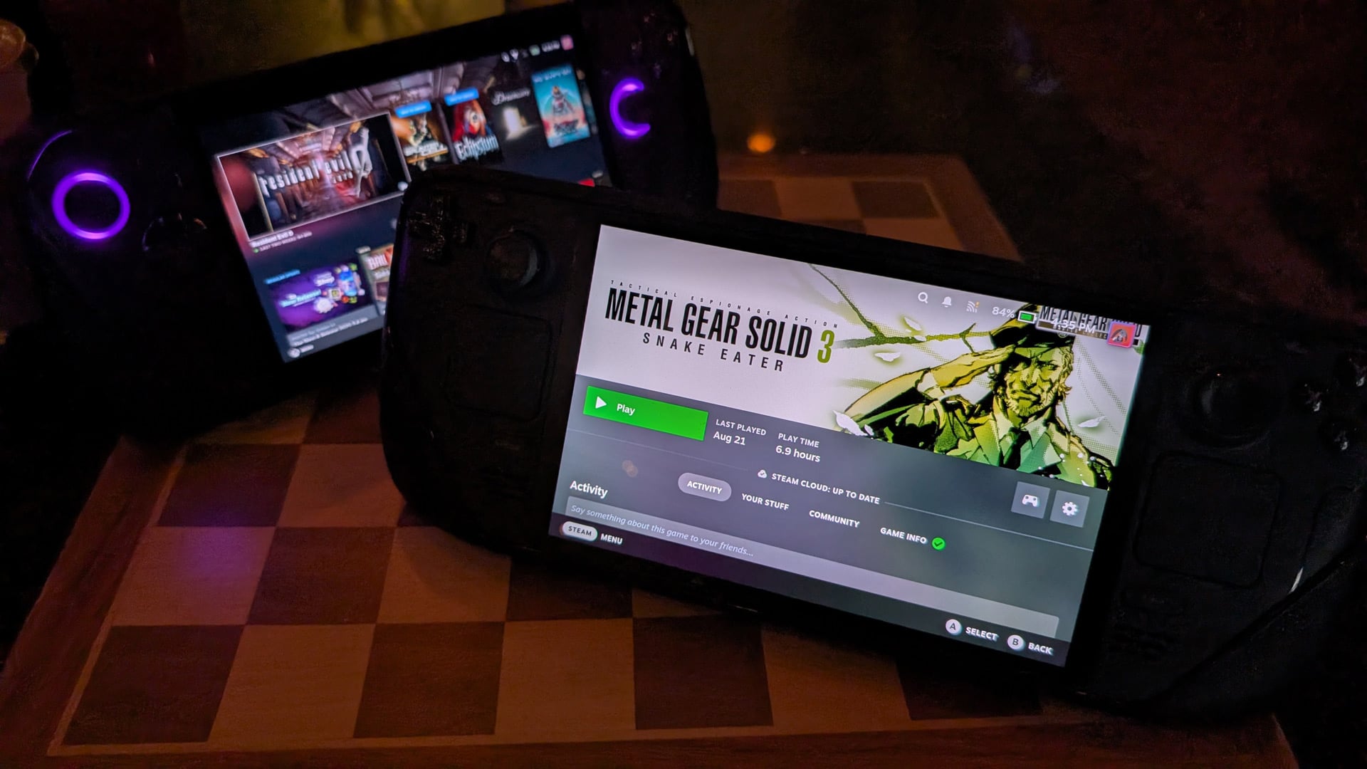 A Steam Deck and ROG Ally X stand on kickstands,