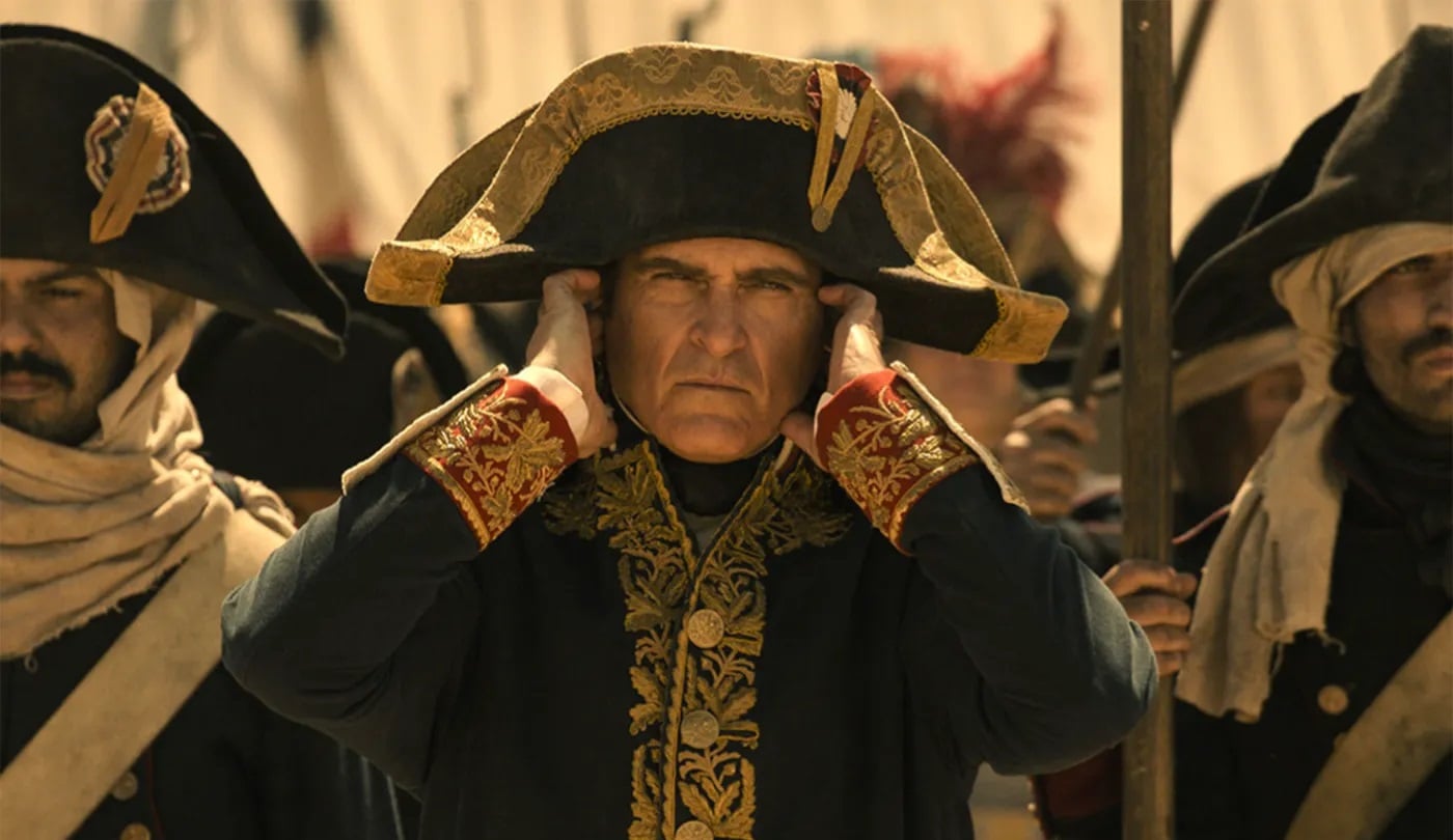 Napoleon puts his fingers in his ears.