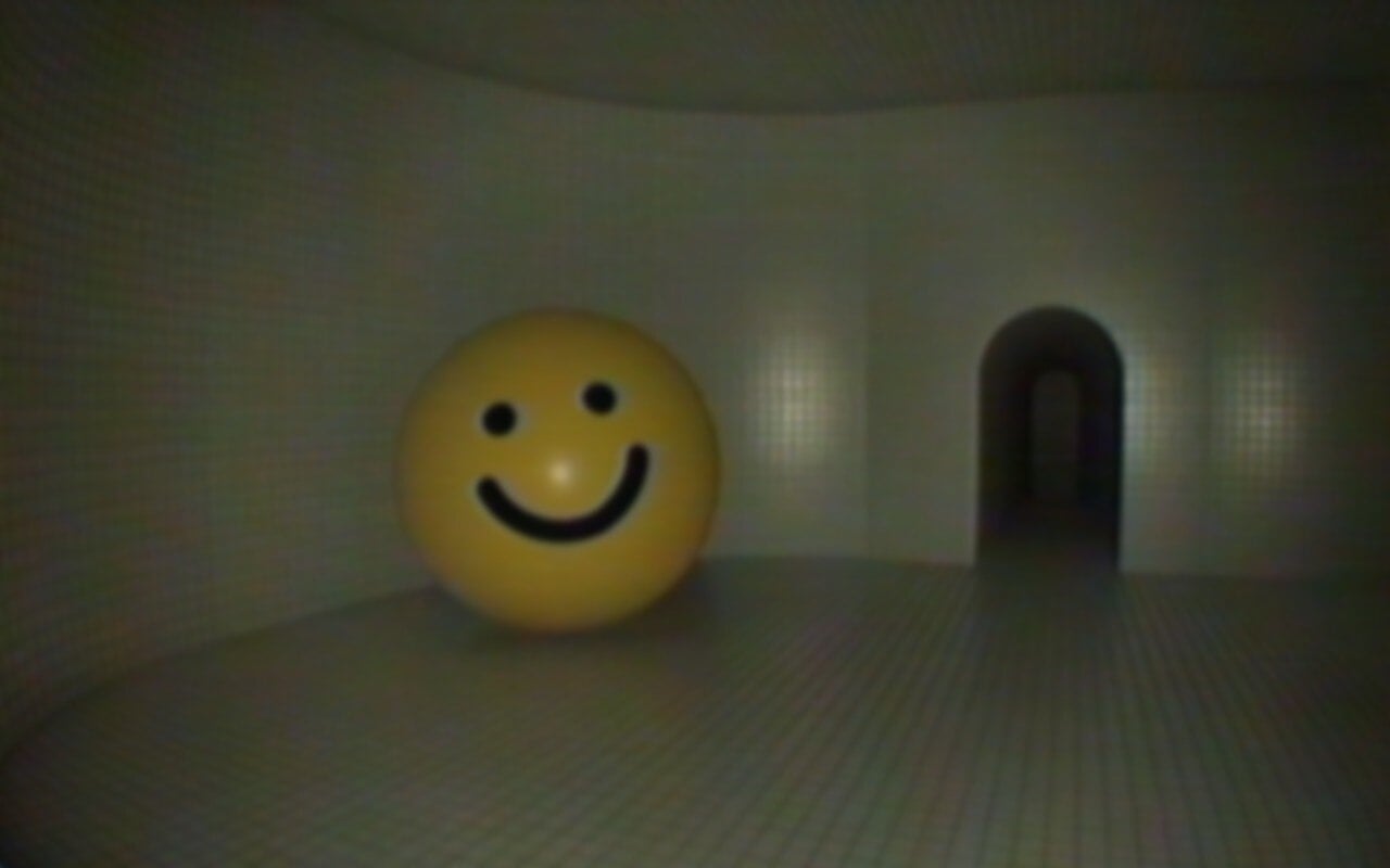 A big yellow smiley ball sits in an abandoned space.