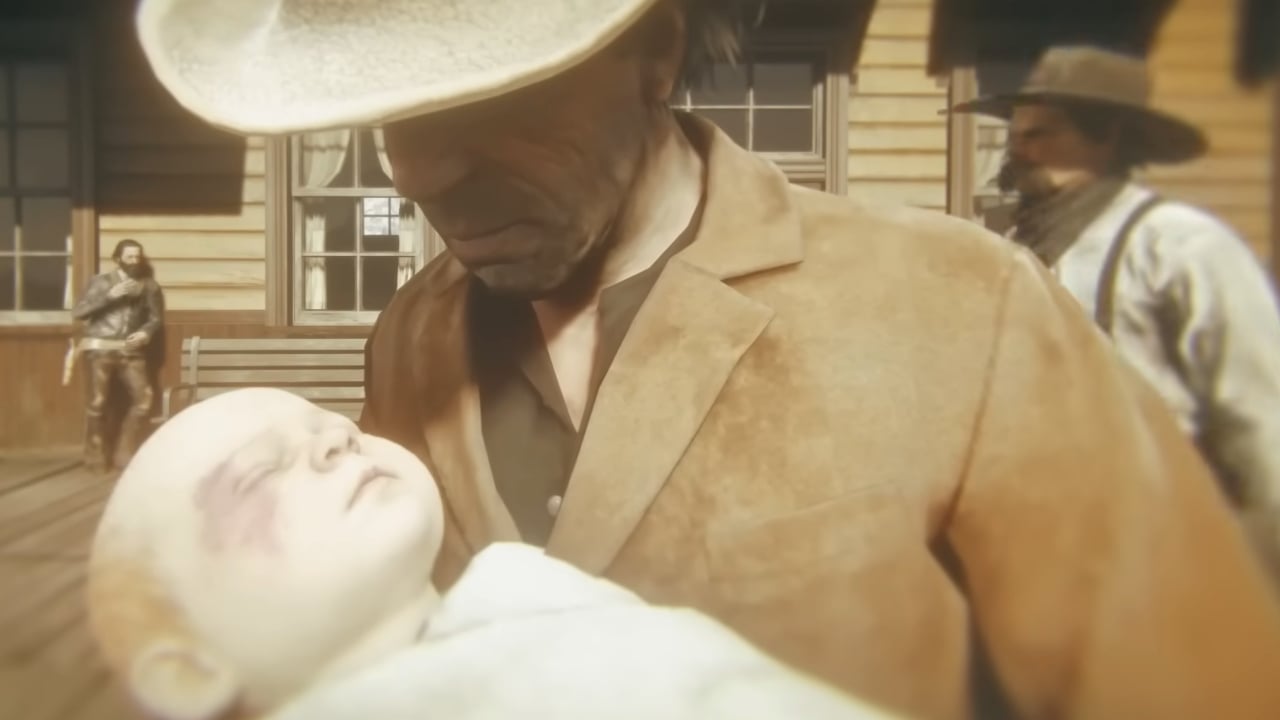 A man looks at a newborn baby