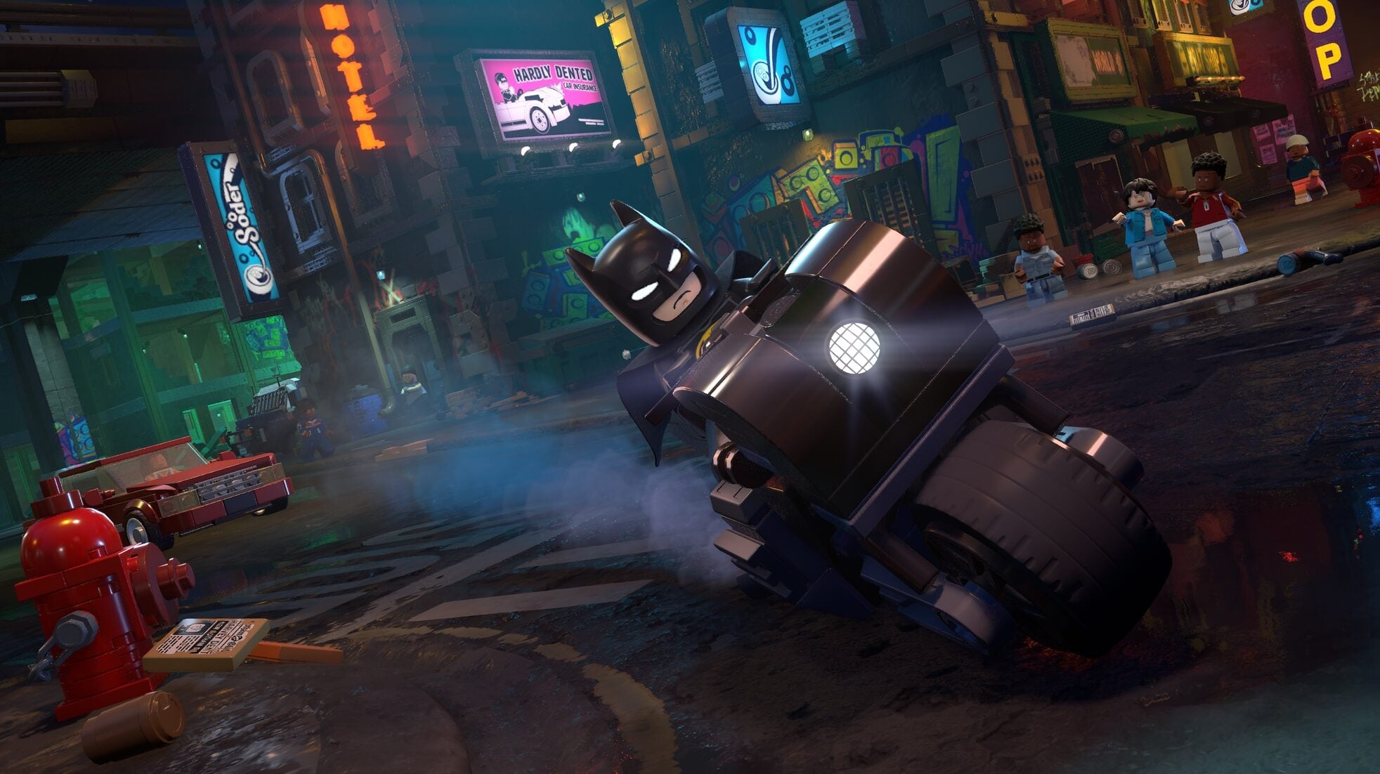 Lego Batman riding on a motorcycle.