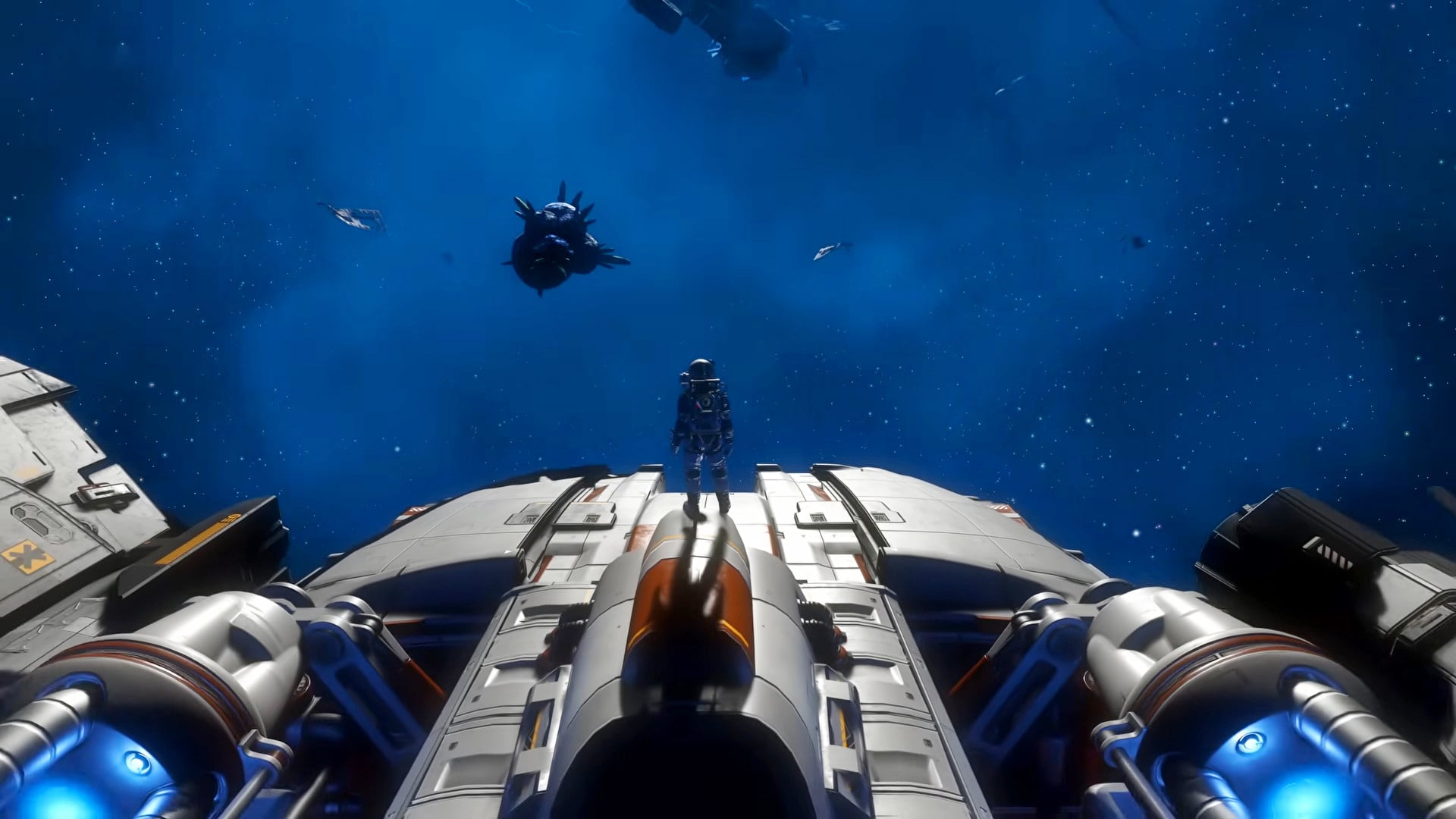A player stands on a ship looking out at space.