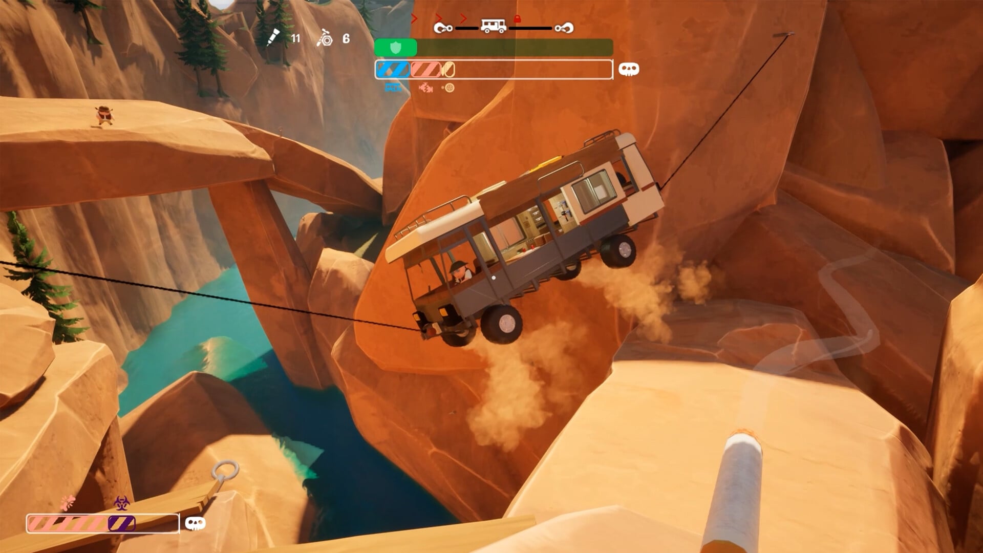 An RV is suspended over a canyon by two winches.
