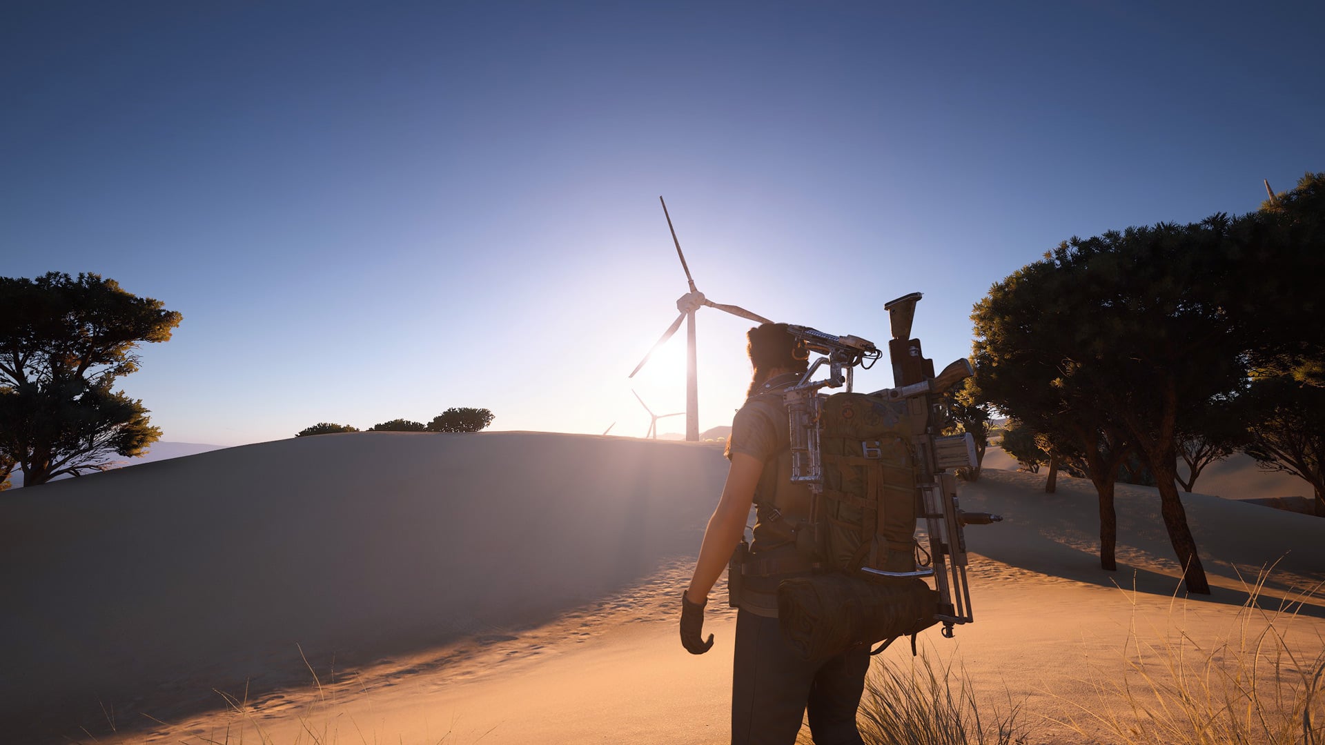 A player character looks out at a windmill in the distance.