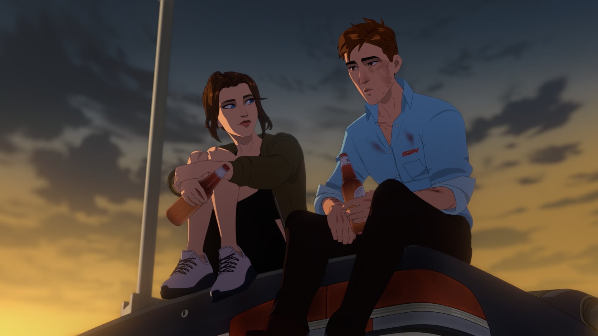 Robert and Blazer sit on top of a car hood drinking beers.