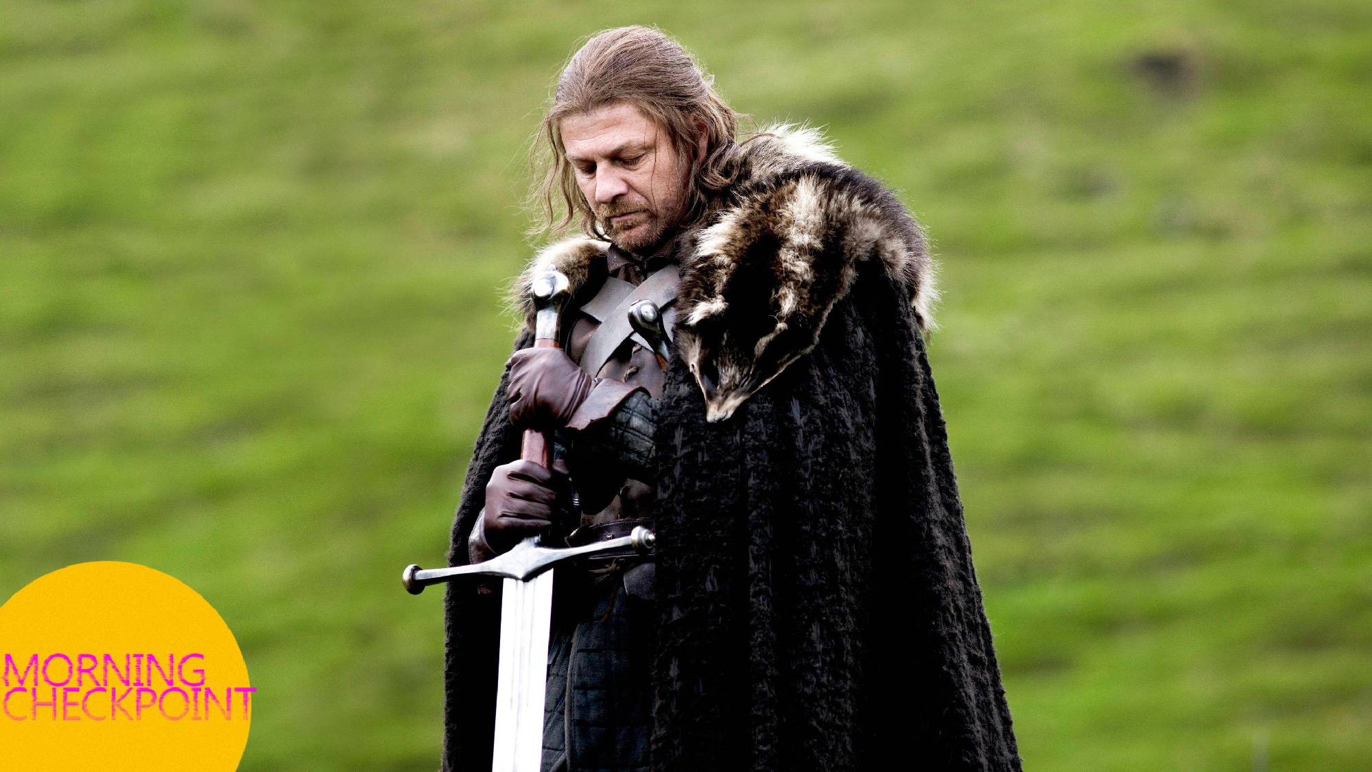Ned Stark looks at the ground.