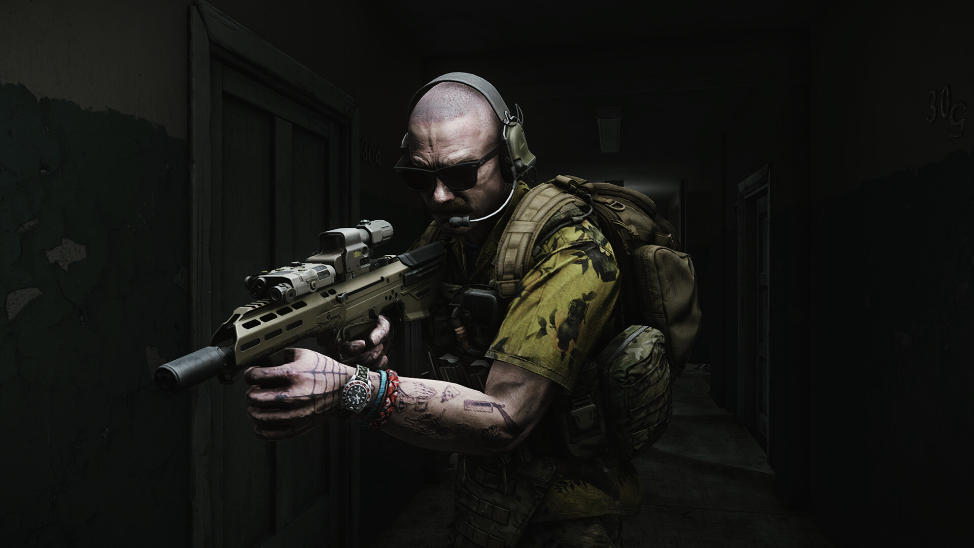 A soldier walks through a dark corridor with a gun.