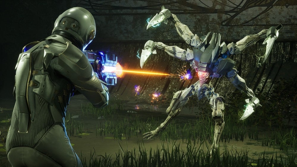 A space marine shoots a robot alien.