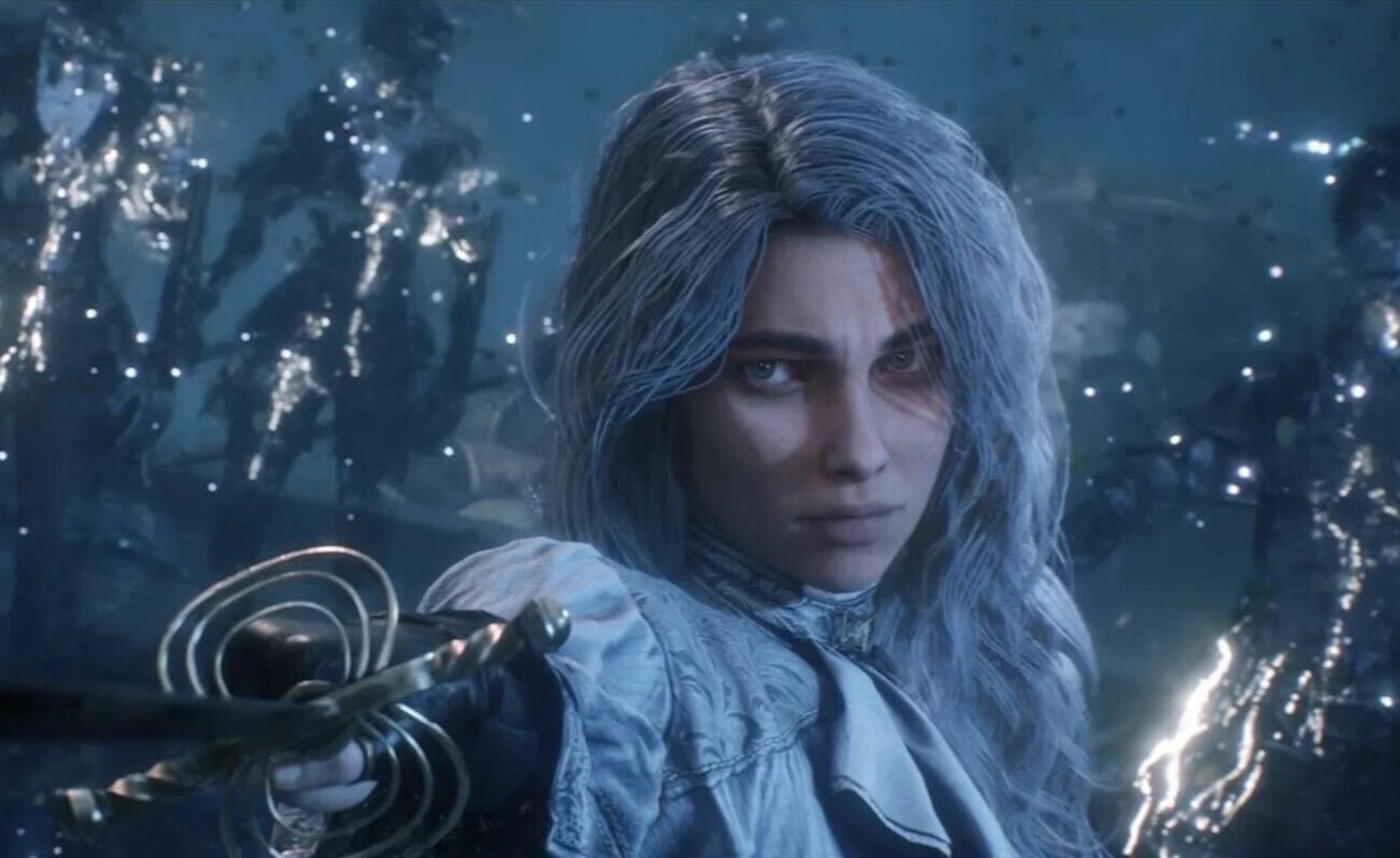 A woman holds up a sword and points it at the camera.