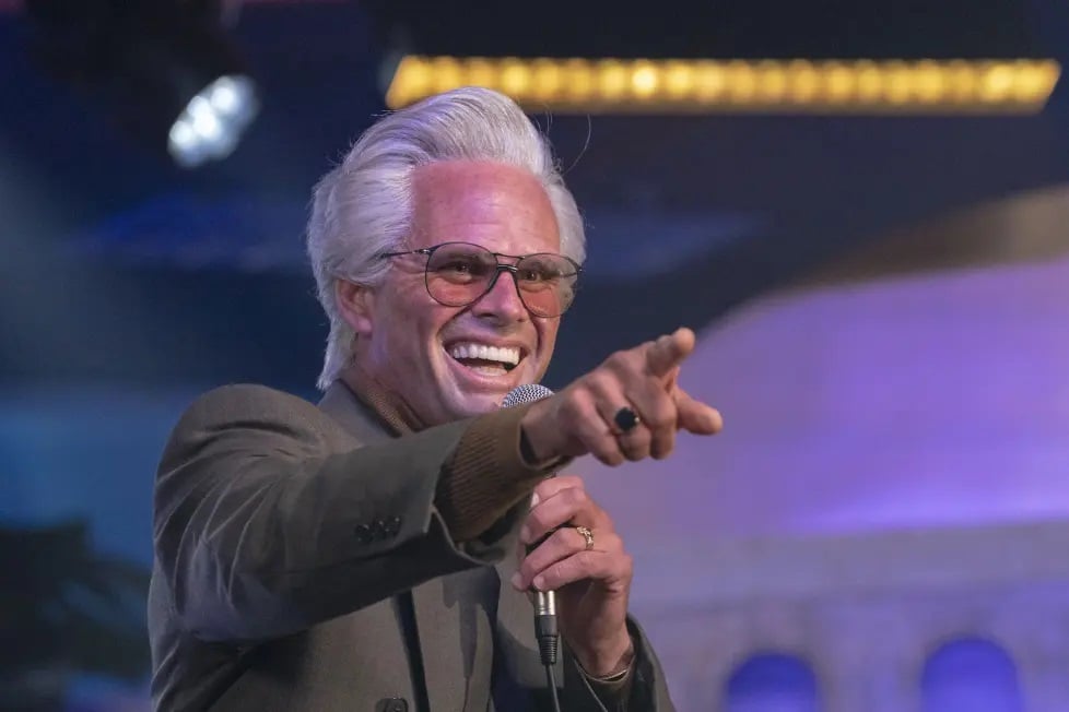 Walter Goggins points at the camera.