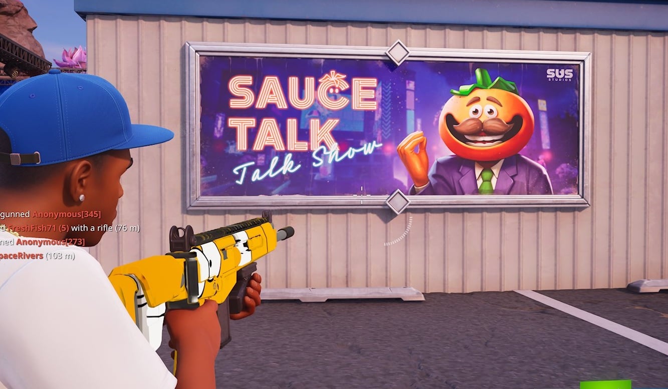 A player takes aim at a Fortnite poster.