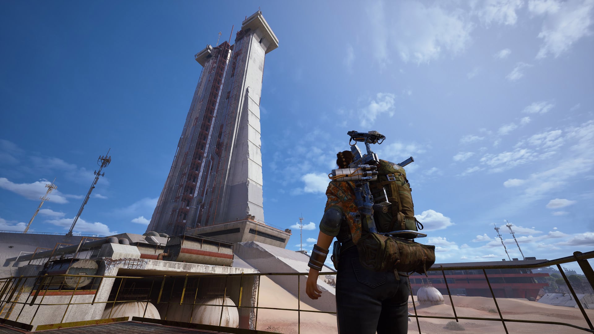 A player looks up at the Launch Towers in Spaceport.