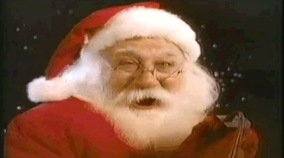 Santa holds a controller.